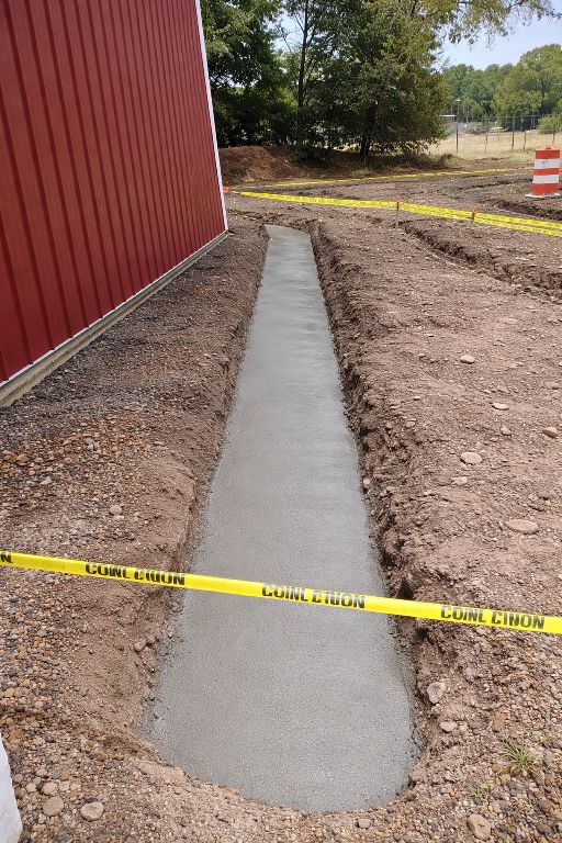 Concrete footer trench drain installation in New Jersey by GradeCraft