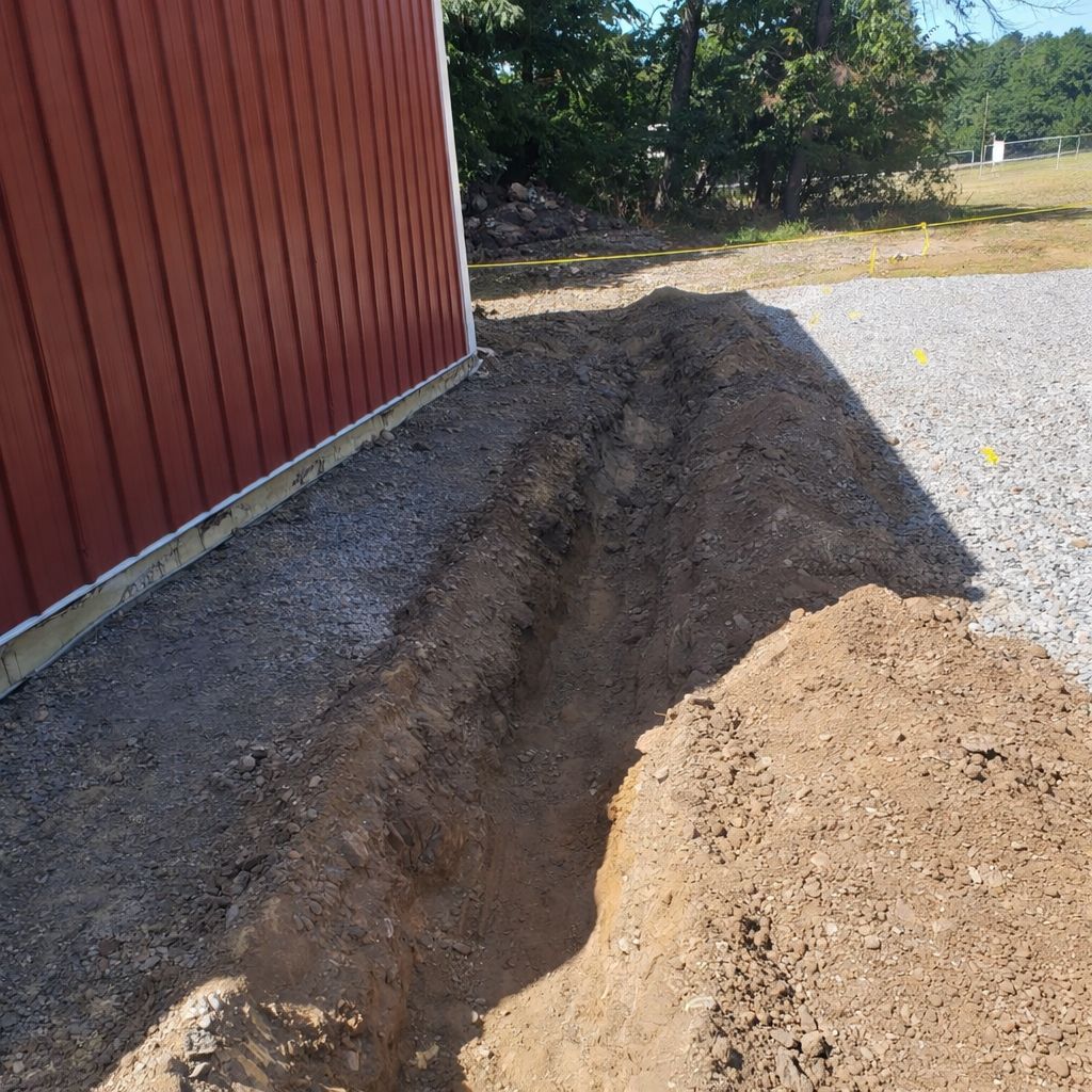 Precision trenching on gravel lot Blairstown NJ